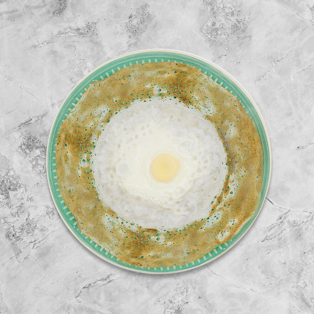 Bowl-shaped fermented rice pancake topped with an egg,  freshly handmade by Amma Lalli. Makes a great savoury snack! 