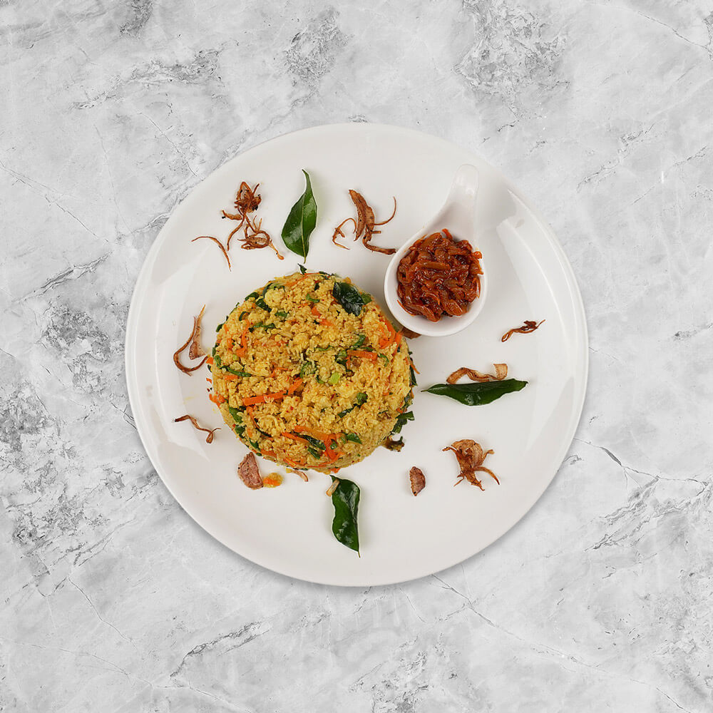 Light & fluffy steamed string hoppers, made from rice flour. Shredded, chopped and tossed Colombo street style with vegetables.